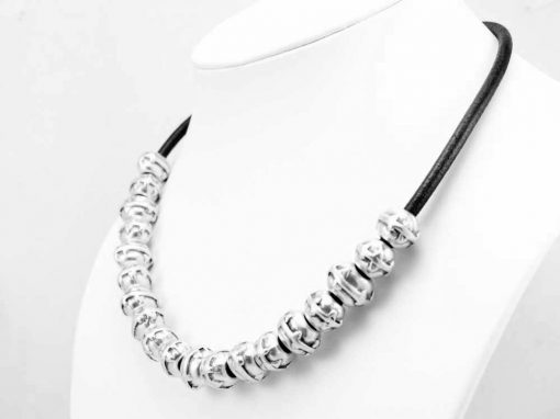 Black leather and silver necklace.